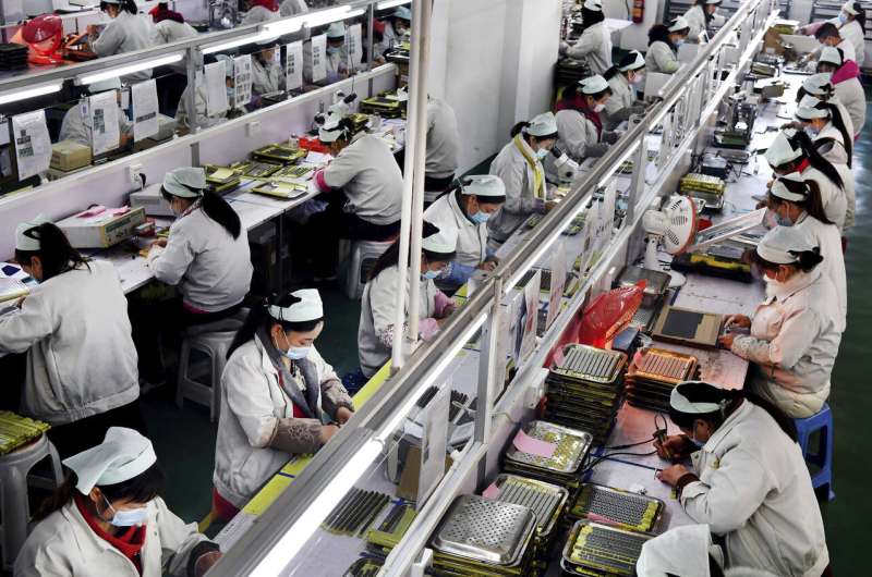 China's factories try to shield workers as output revives