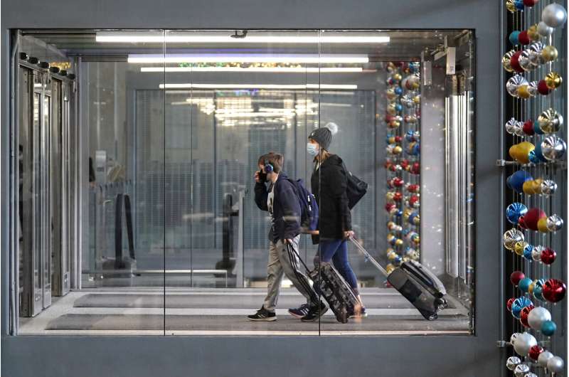 Holiday air travel surges despite dire health warnings