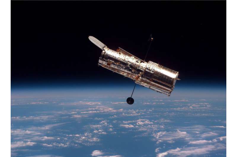 Hubble's impactful life alongside space debris