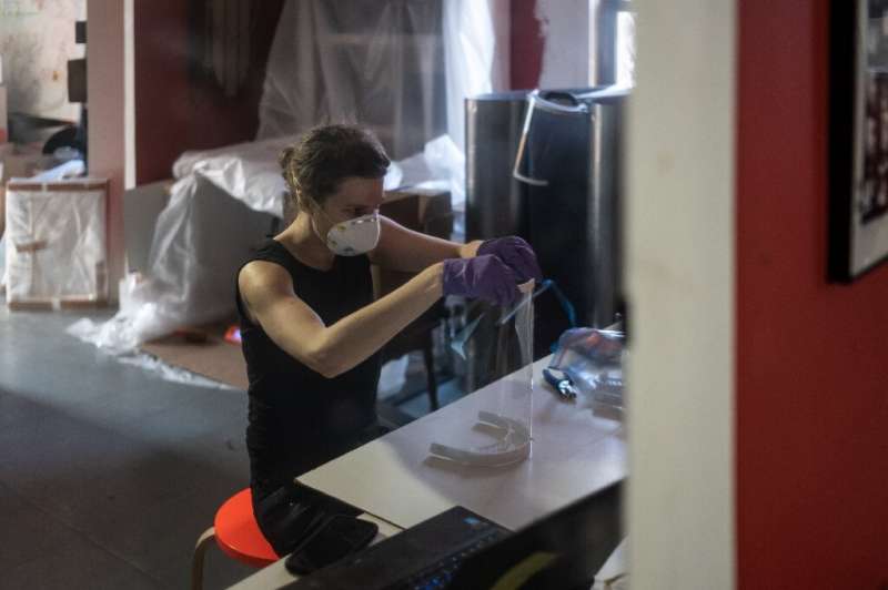 Luba Drozd makes protective shields for health workers in her apartment on her 3D printers, having raised money for supplies in 