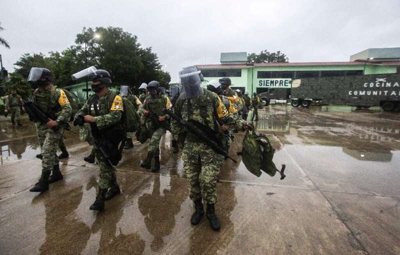 Mexican troops prepare to deploy in preparation for the arrival of Hurricane Delta