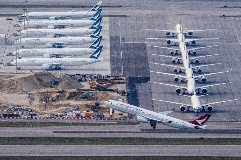 Most of Cathay's passenger planes lie unused on Hong Kong airport's tarmac during the pandemic