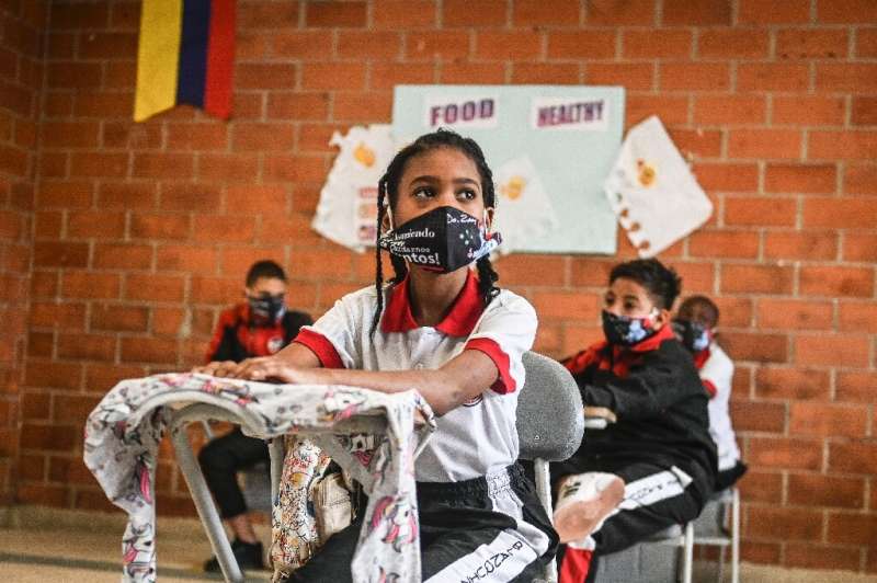 Students attend a class at the Blanquizal Public school during its reopening in Medellin, Colombia