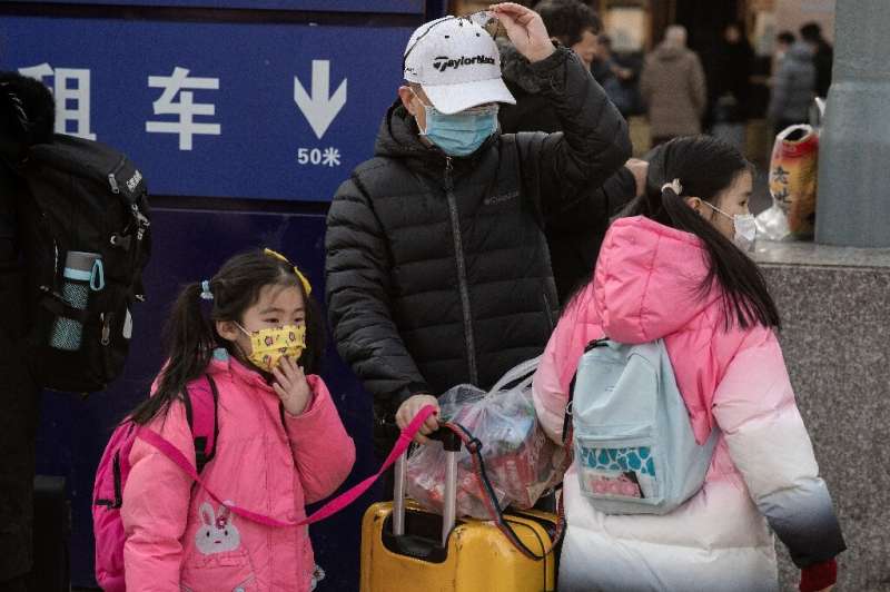 The discovery of human-to-human transmission comes as hundreds of millions of people are criss-crossing China in packed trains, 