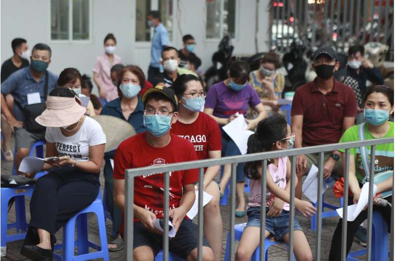 Vietnam reports 1st ever virus death after renewed outbreak