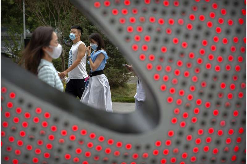 China tames new outbreak but elsewhere virus cases surge