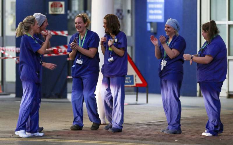 "We love you NHS": UK health service gears up for virus peak