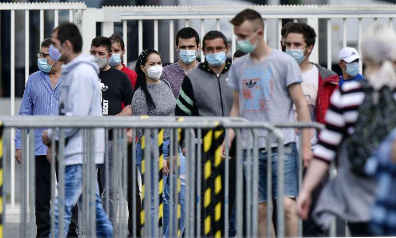 Britain lowers virus alert, Germany sees spike in cases