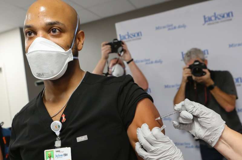 Medical staff and vulnerable patients were among the first to be vaccinated in the US
