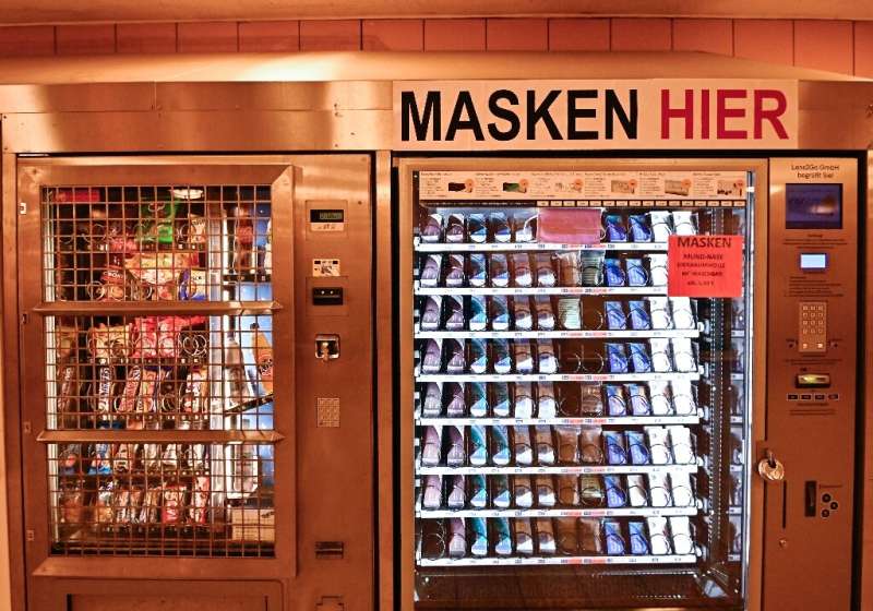 Face masks are sold in a vending machine in a Berlin subway station