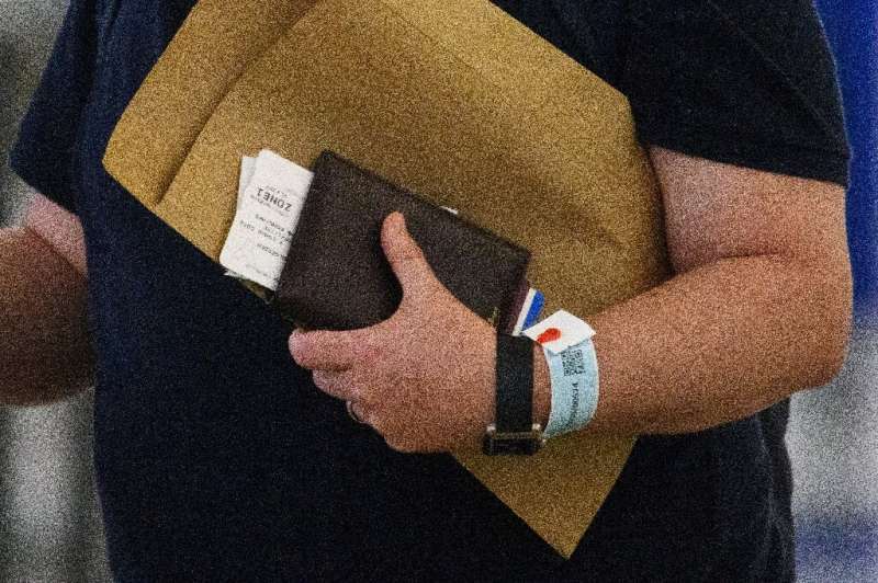 Governments are using various kinds of tracking such as these electronic bracelets in Hong Kong connected to an app to monitor p