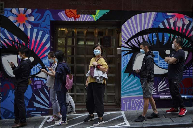 Hong Kong leader urges people to stay home as cases rise