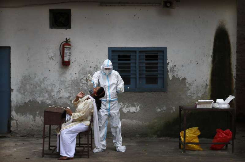 India eases virus restrictions as cases near 3.7 million