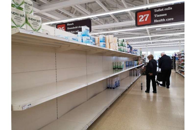 Near empty shelves on the toilet paper aisle in a supermarket in London after stockpiling by consumers