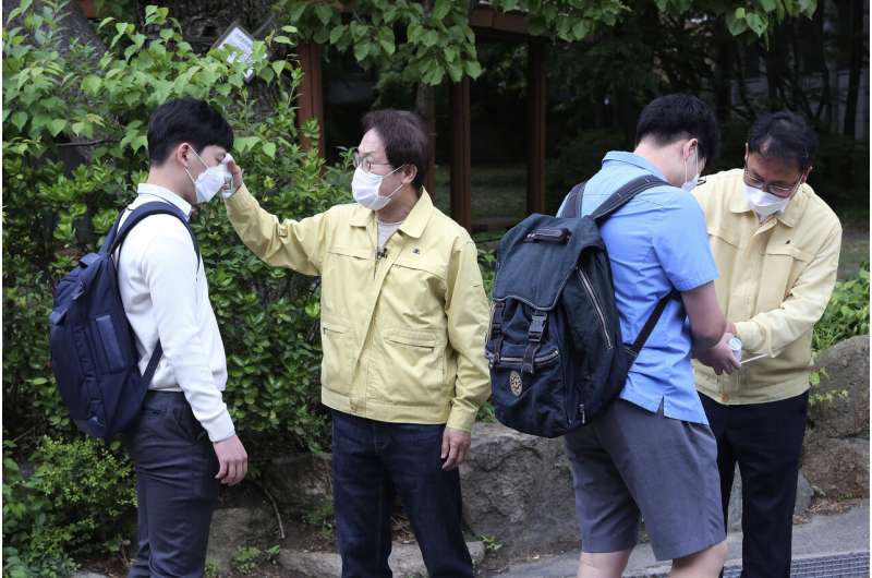 South Koreans return to school amid virus outbreak