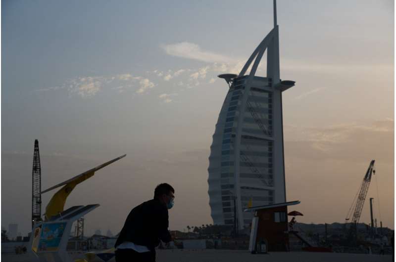 Travel hub UAE to halt flights as virus reaches Gaza, Syria