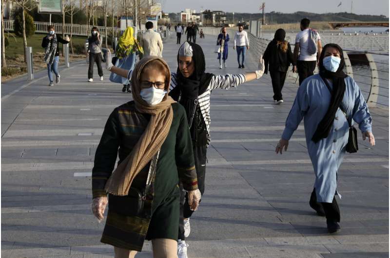 Virus toll in Iran climbs as lockdowns deepen across Mideast