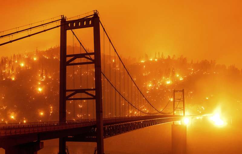 California wildfire explodes, burning across 25 miles in day