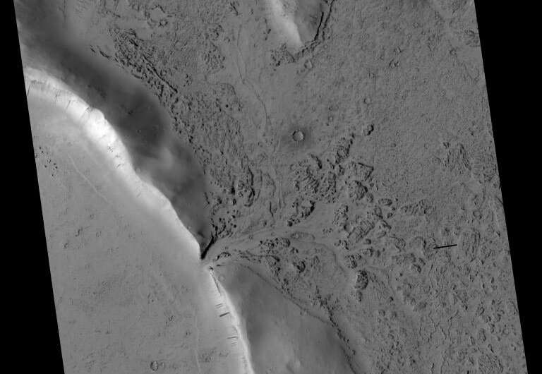 Images reveal where lava broke through the wall of a Martian crater and began filling it up