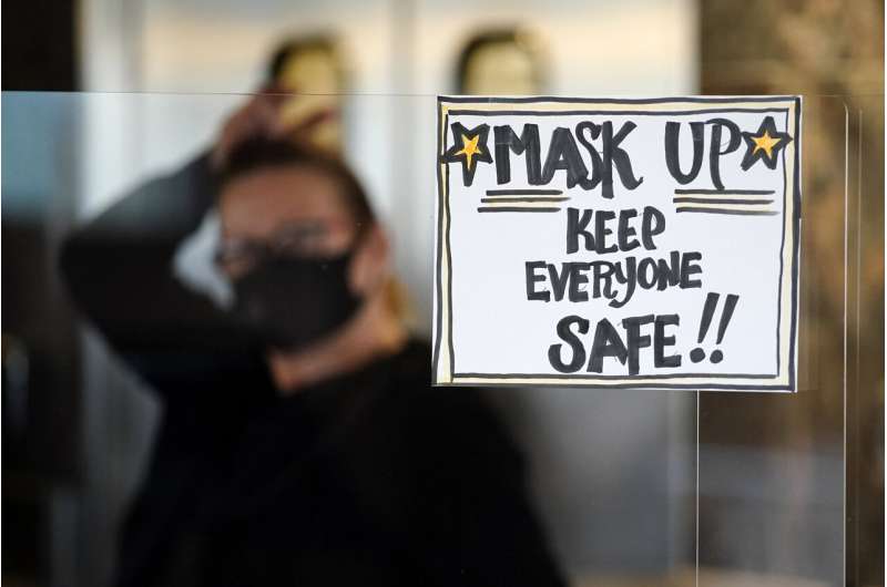 Keep the mask: A vaccine won't end the US crisis right away
