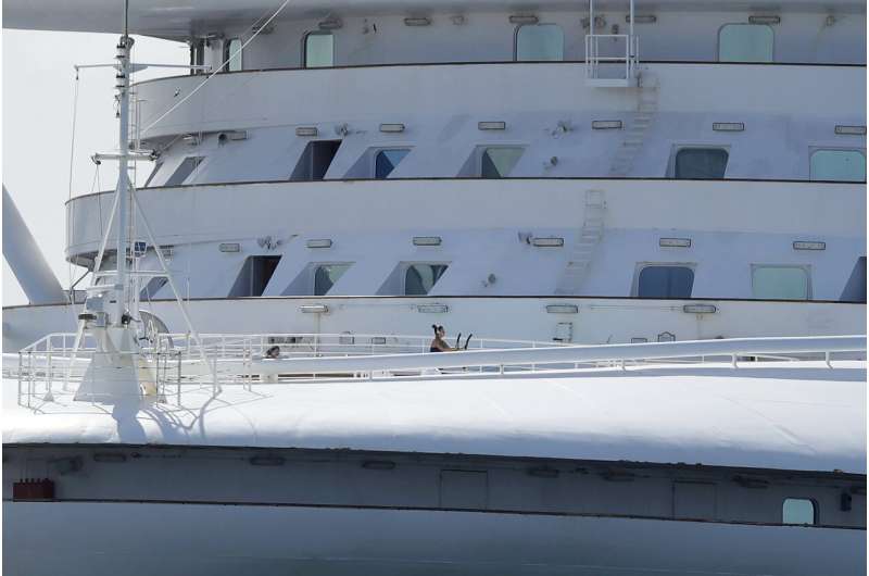 Thousands on virus-hit cruise ship await disembarkation