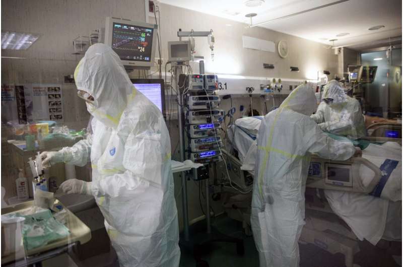 With more infections than China, Spain tightens lockdown