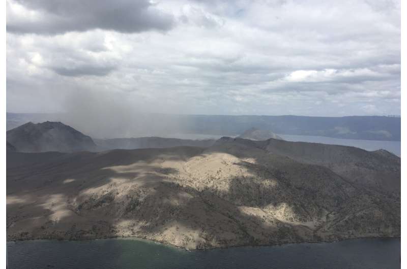 Philippine volcano alert lowered, thousands return home