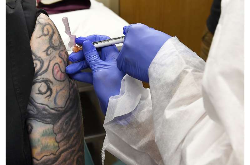 AP-NORC poll: Only half in US want shots as vaccine nears