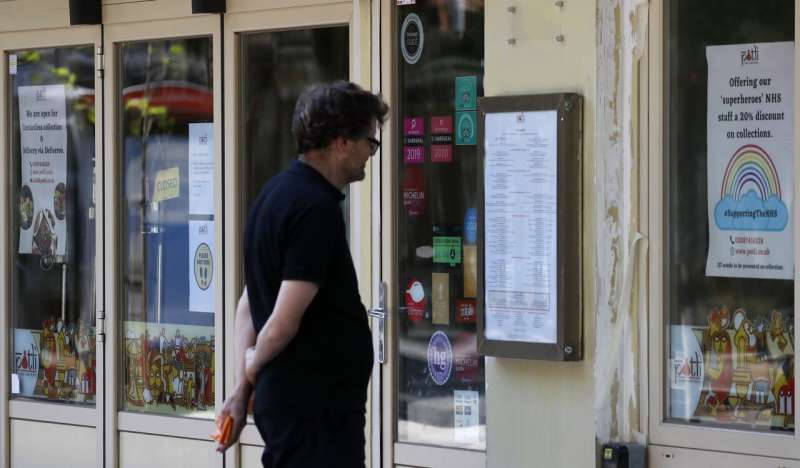 Pubs, restaurants in England to reopen as virus toll eases