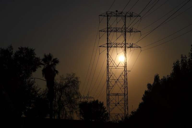 Electrical power lines are seen in Los Angeles on August 19, 2020 during a triple-digit heatwave