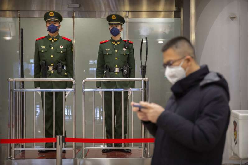 Virus cases in China top SARS as evacuations begin