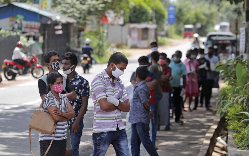 Sri Lanka widens curfew, bans gatherings as virus surges