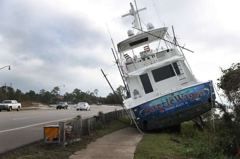 A boat registered in Orange Beach, Alabama, washed ashore after Hurricane Sally