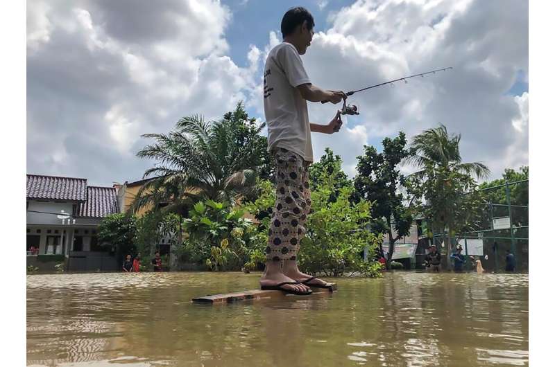 Across the city, kids took the opportunity to swim in the floodwaters while some people grabbed fishing rods