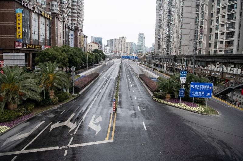 A deserted street in Shanghai, as fear of the spread of the virus impacts cities across China, even those not in lockdown
