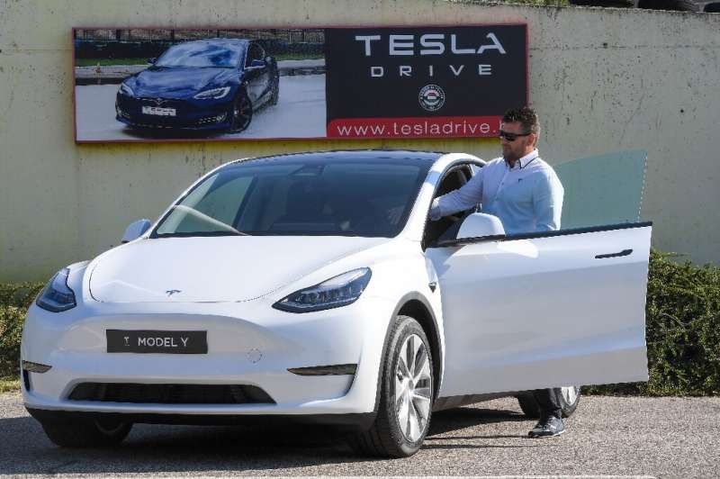 A driver prepares to test drive a Tesla on September 5, 2020, during a presentation at the Automobile Club of Budapest