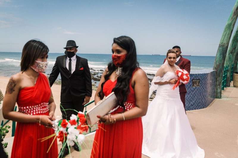 A masked wedding party celebrates in Durban, South Africa