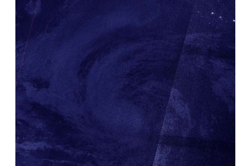 A NASA-NOAA nighttime view finds a slightly better organized tropical storm Karina