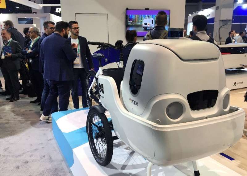 An electric cargo bike from Italian startup Measy uses a delivery robot from sister company Yape for multimodal transportation a