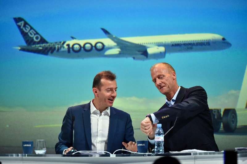An internal Airbus probe was a factor in the departure of executive chairman Tom Enders (R), who was replaced as chief executive