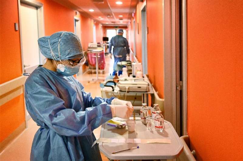 A nurse prepares medical equipment at the new COVID-3 level intensive care unit, treating COVID-19 patients, at Casal Palocco ho