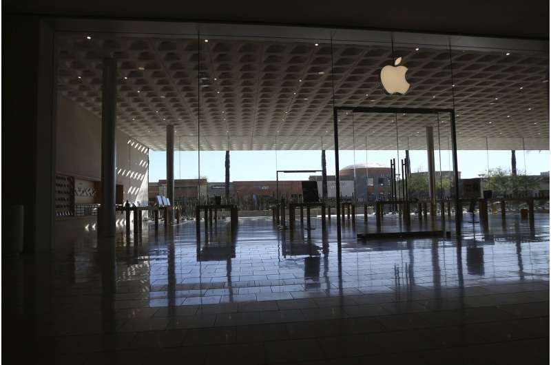 Apple re-closes some stores, raising economic concerns