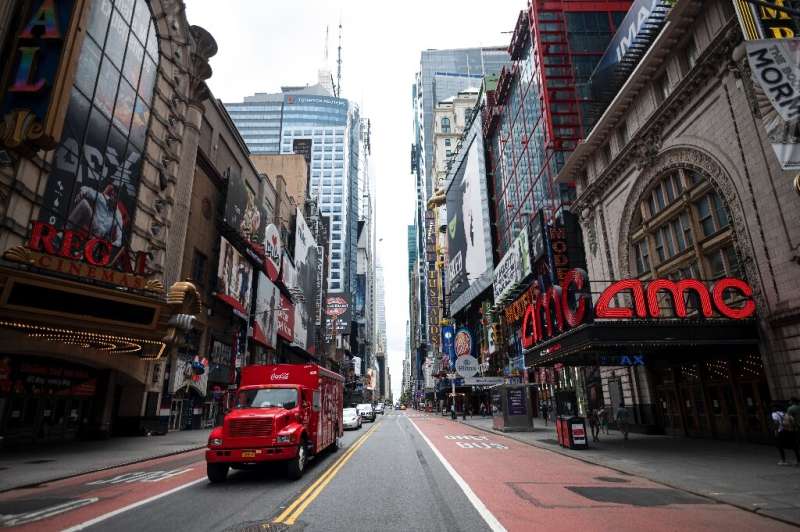 A truck drives along normally bustling 42nd Street in Manhattan on June 30, 2020