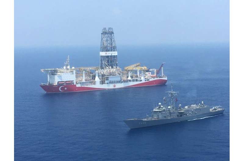 A Turkish Navy warship patroling next to Turkey's drilling ship 'Fatih' which made the major gas discovery in the Mediterranean