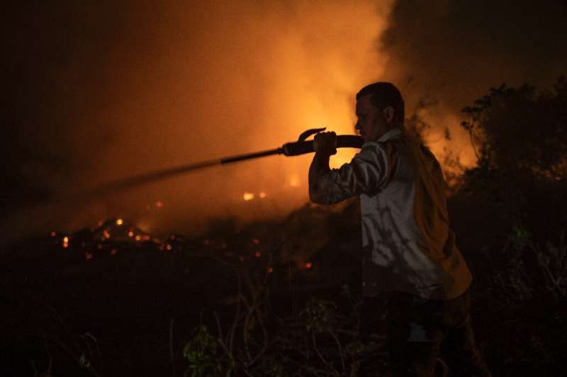 A volunteer combats a fire in Brazil's Pantanal, the world's largest tropical wetlands