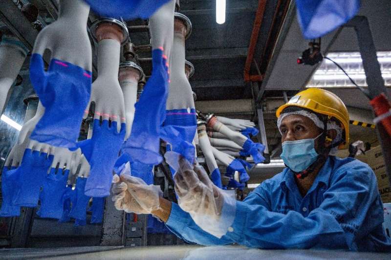 A worker on the production line of a Top Glove factory in Shah Alam, near Kuala Lumpur, in August 2020