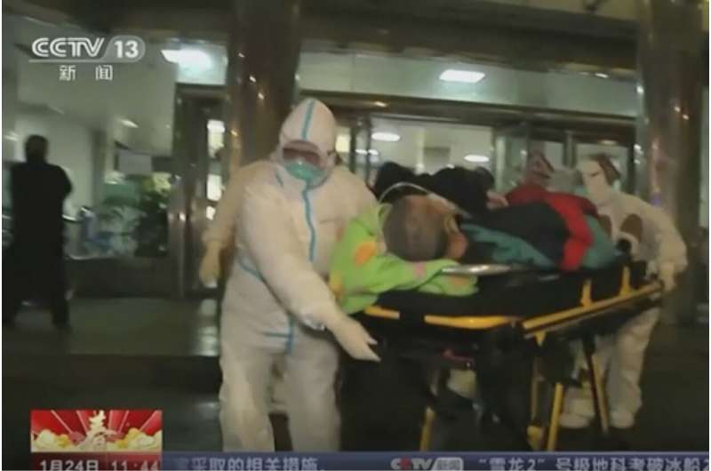China expands lockdown against virus, fast-tracks hospital