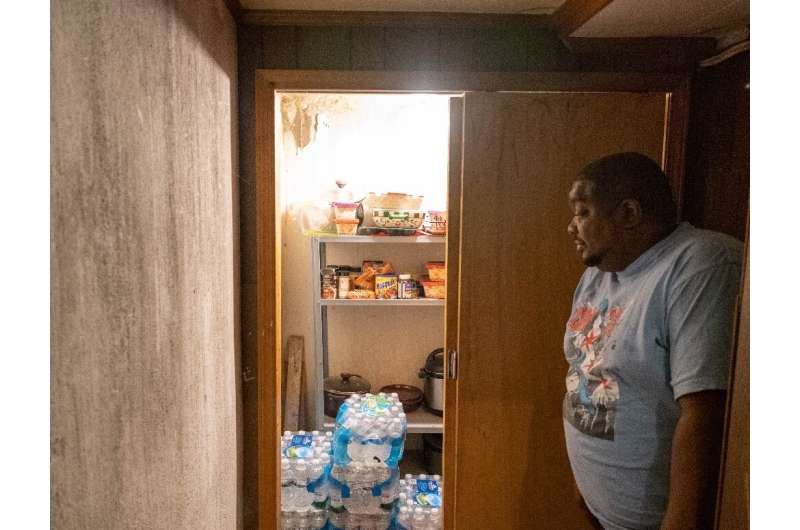 Cleophus Mooney of Flint, Michigan keeps his water in the basement and in the garage