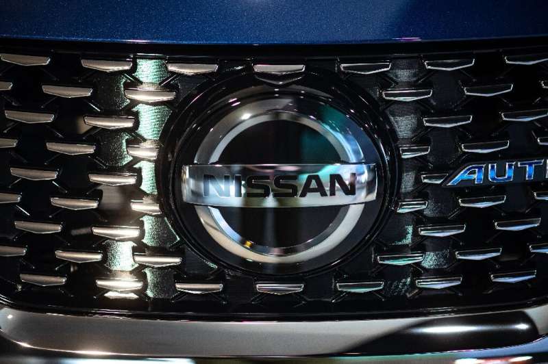 Crisis-hit Japanese automaker Nissan says it has trimmed losses in the second quarter and upgraded its full-year forecasts