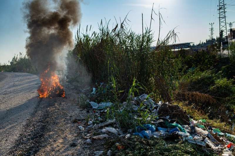 Dumped illegally alongside roadsides, some of the plastic waste is burned to get to metal, letting noxious fumes into the air
